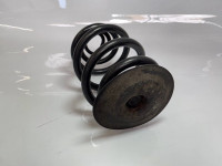 Coil spring with pad