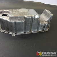 Oil pan with opening for oil level sensor